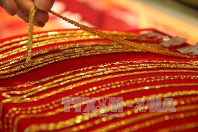 Vàng khép lại năm mất giá thứ ba liên tiếp ảnh 1